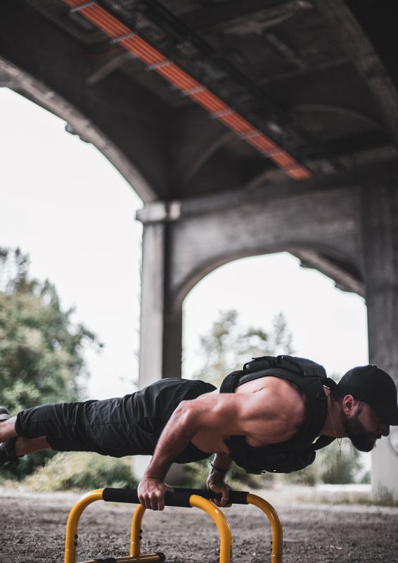 Athlete wearing the MVRK weighted vest during an outdoor bodyweight workout